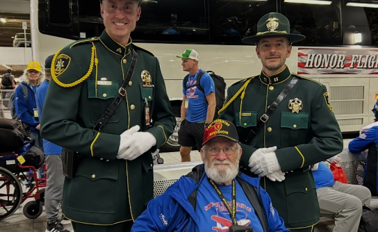 MCSO Sgt. Bryan White (left) and Captain Lance Hemsworth (right) represent the MCSO Honor Guard at the Honor Flight reception.